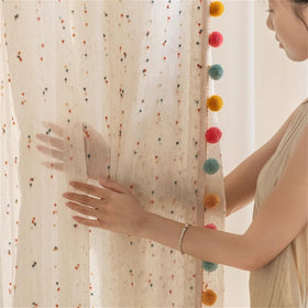 WJLQLM white linen-look sheer curtain creates cozy, diffused daylight in nursery.