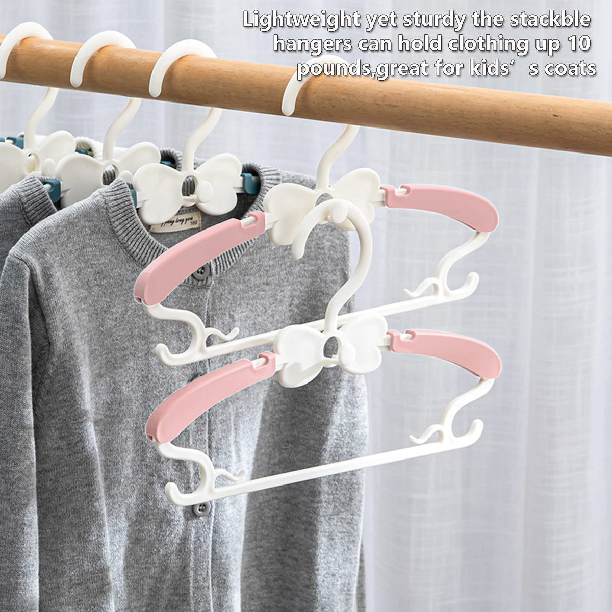 WJWSKI pink center bow hook highlighting accessory organization on a hanger.