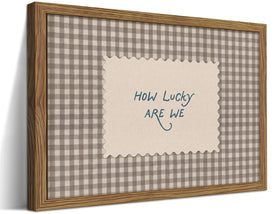 WLHARTT How Lucky Are We wall art with gingham frame provides cozy inspiration for living rooms.