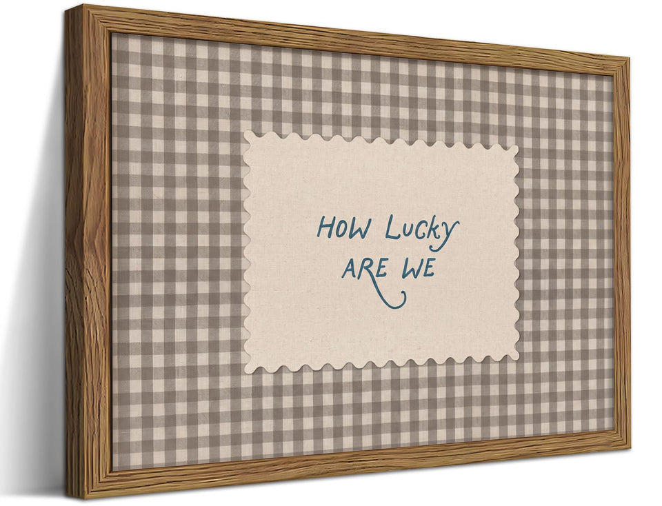WLHARTT How Lucky Are We wall art with gingham frame provides cozy inspiration for living rooms.