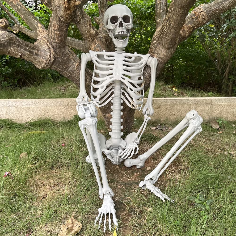 Wocst skeleton posing in living room decor for Halloween vibe.