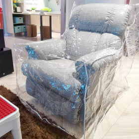 Wokire heavy-duty recliner cover with clear plastic protecting upholstery while keeping the chair visible