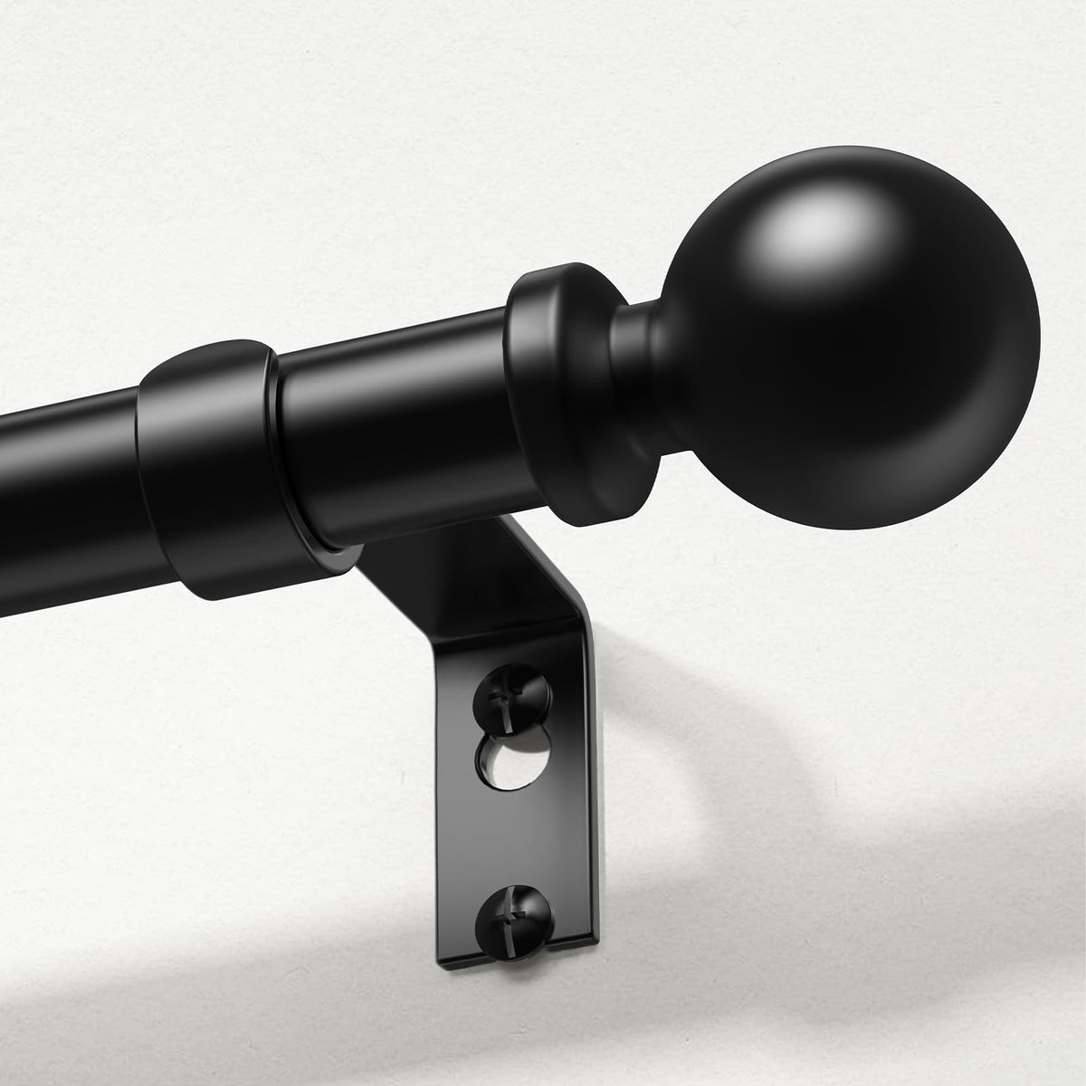 Wolistsa curtain rod with black finials at both ends, enhancing bedroom or living room style.