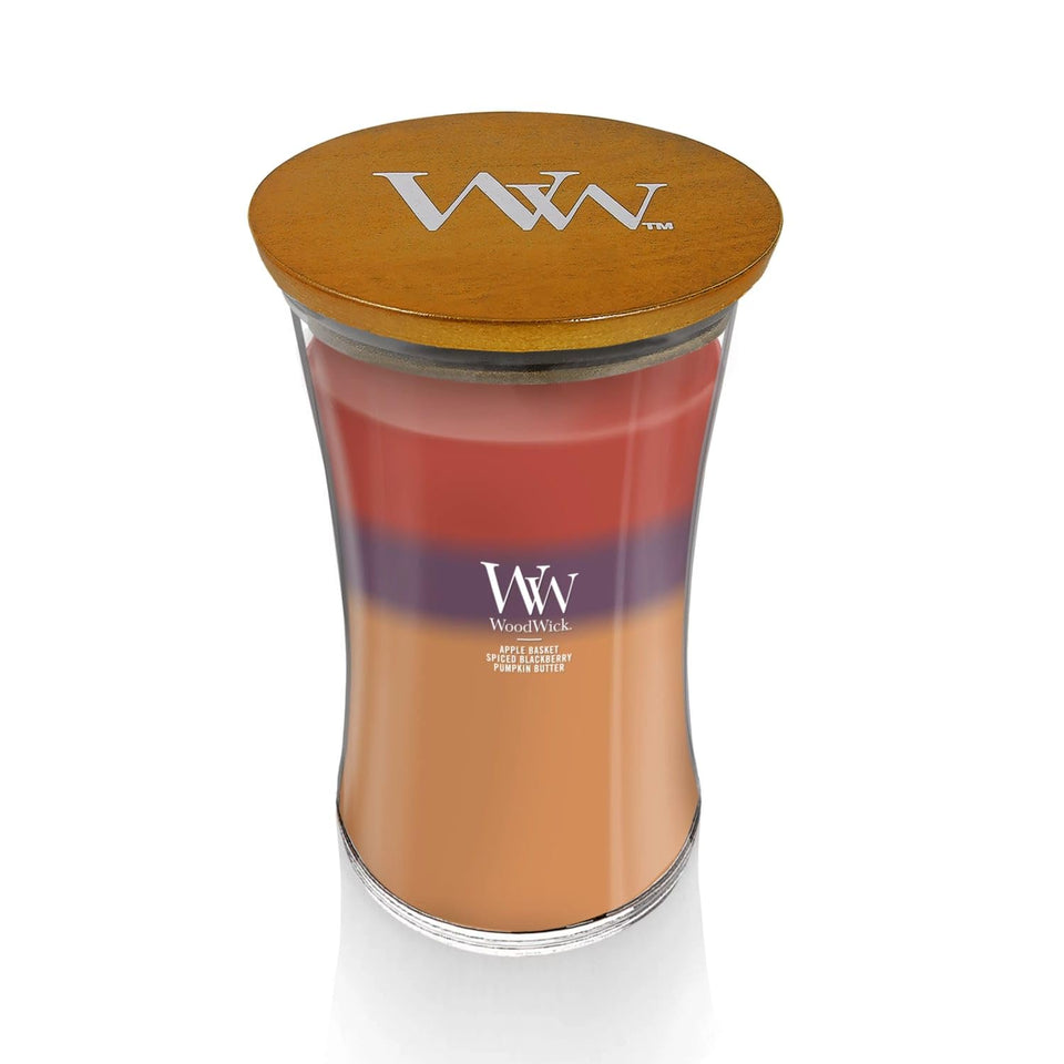 WoodWick Autumn Harvest Trilogy candle in hourglass vessel with evolving layered fragrance