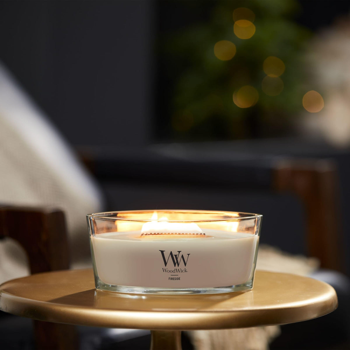 WoodWick ellipse candle crackling wick provides fireplace-like atmosphere for gatherings.