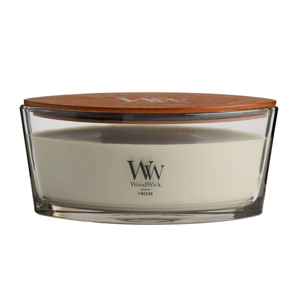 WoodWick Fireside Ellipse candle with warm glow creates cozy home ambiance.