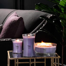 WoodWick Lavender Spa candle on decor shelf evoking spa-inspired ambience.