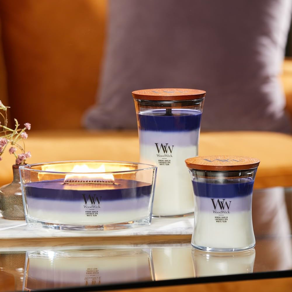 WoodWick Evening Luxe forest-layer aroma enhances immersive fragrance journey.