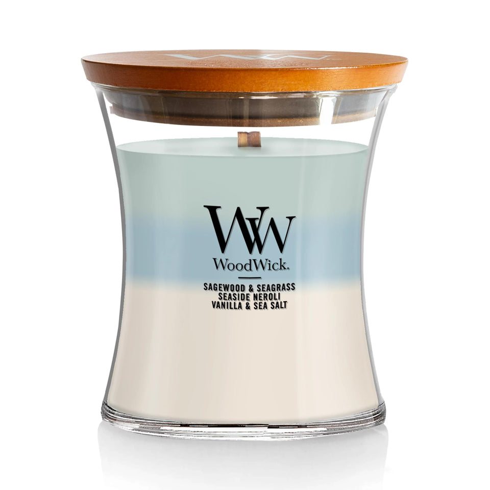 WoodWick Oceanic Trilogy candle jar shows layered scents for an evolving atmosphere.