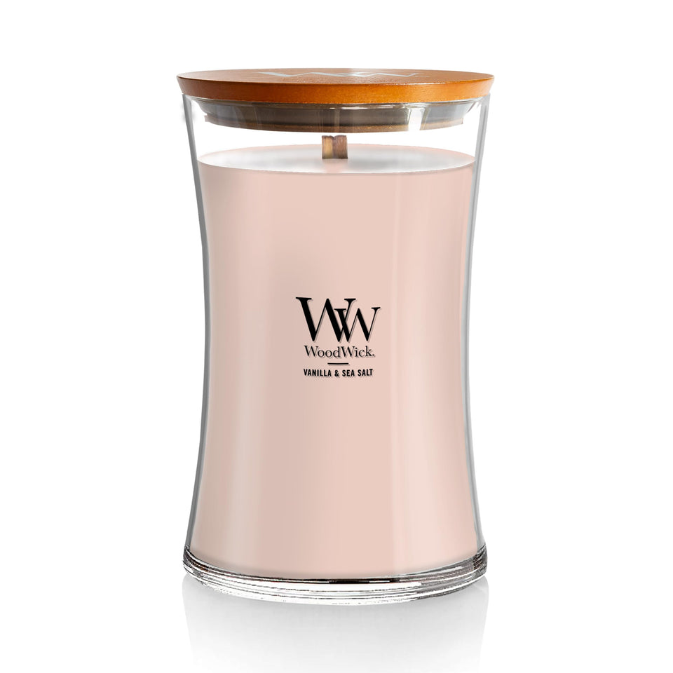 WoodWick Vanilla Sea Salt hourglass candle glowing for cozy evenings