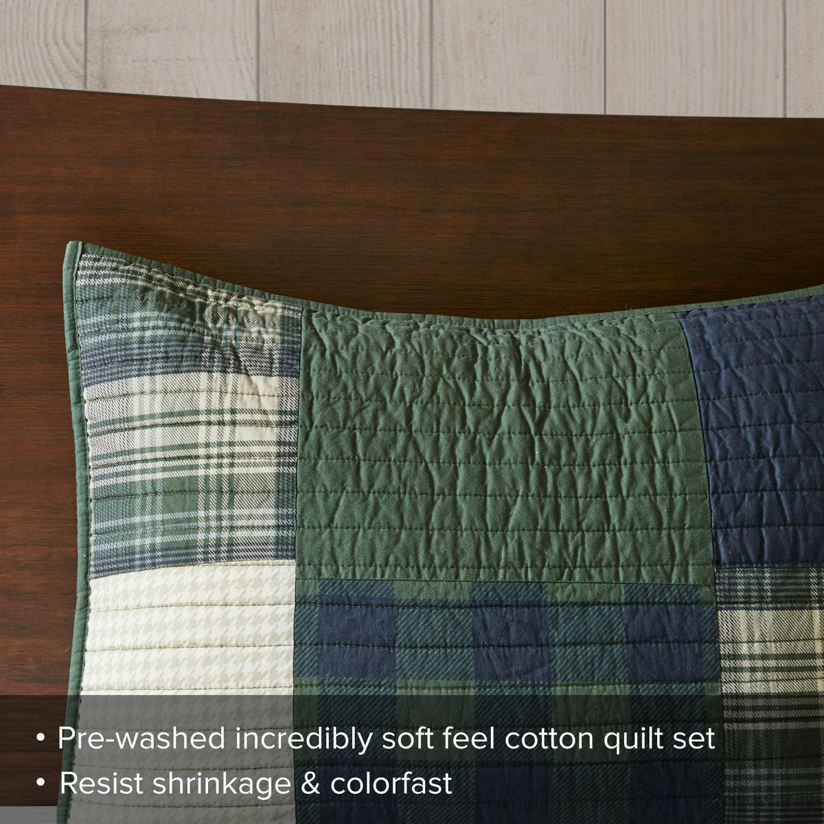 Woolrich Mill Creek patchwork coverlet on bed highlighting breathable warmth and easy care.