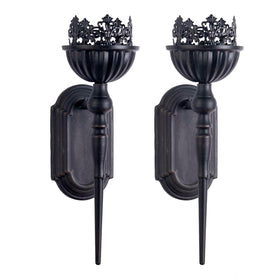 Crown and scepter design sconce enhances dining room ambiance with Gothic style.