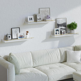 Bathroom storage solution with guardrail keeping toiletries in place on a shelf