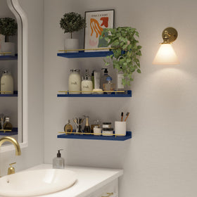 WOPITUES shelves displaying art frames on navy blue backdrop