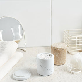 WORHE marble apothecary jar vanity keeps cotton swabs and pads accessible and stylish.