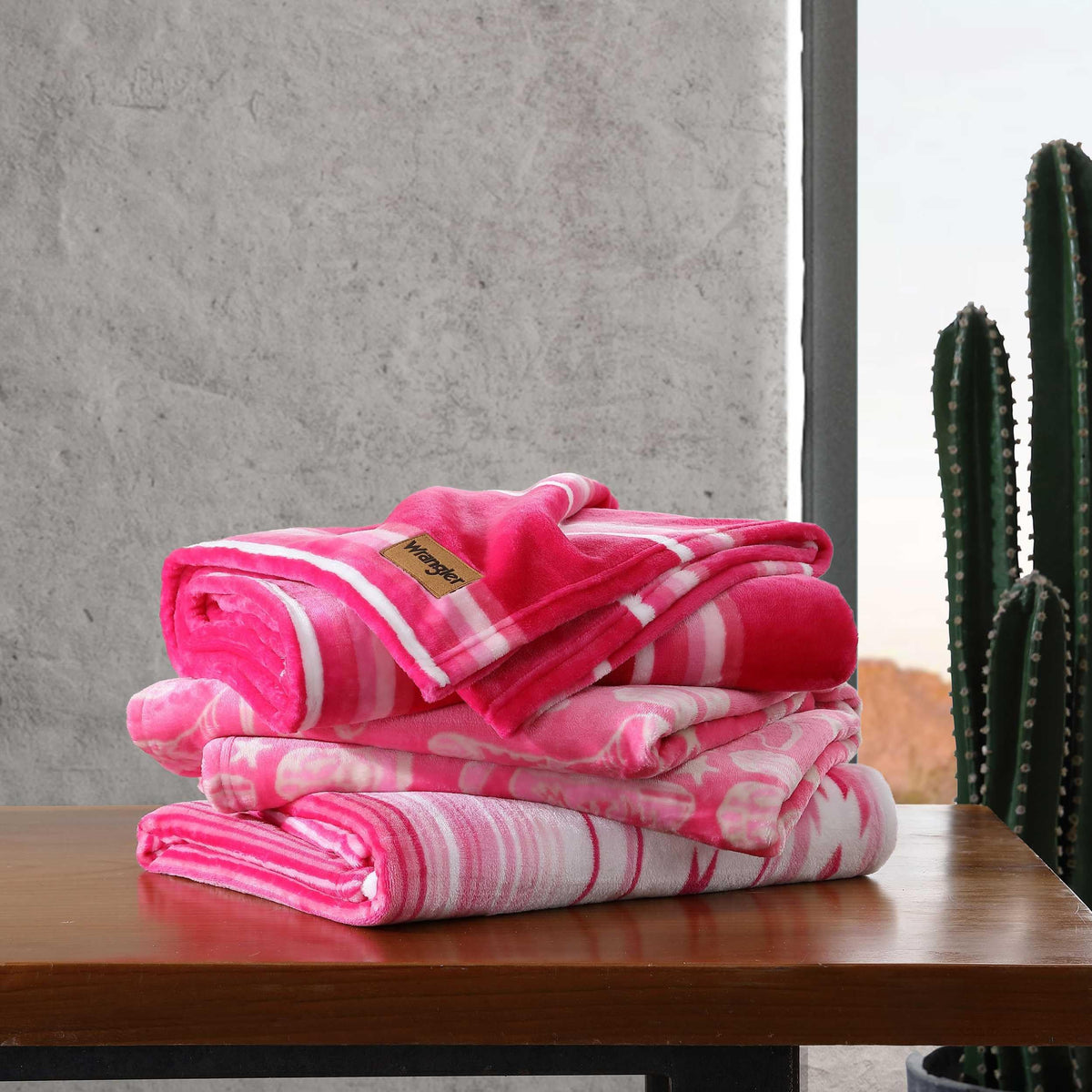 Wrangler plush throw draped on bed adds rustic comfort.