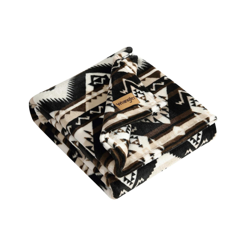Wrangler Sherpa throw on sofa provides cozy warmth for lounging