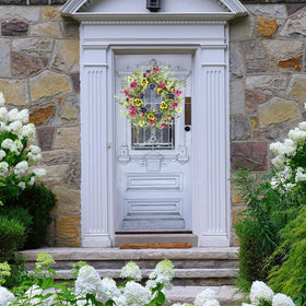 WreathDream wedding or event decor with bright floral focal point.