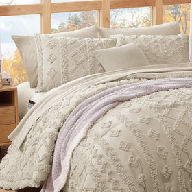 WRENSONGE beige tufted bedding set on bed for elegant bedroom look