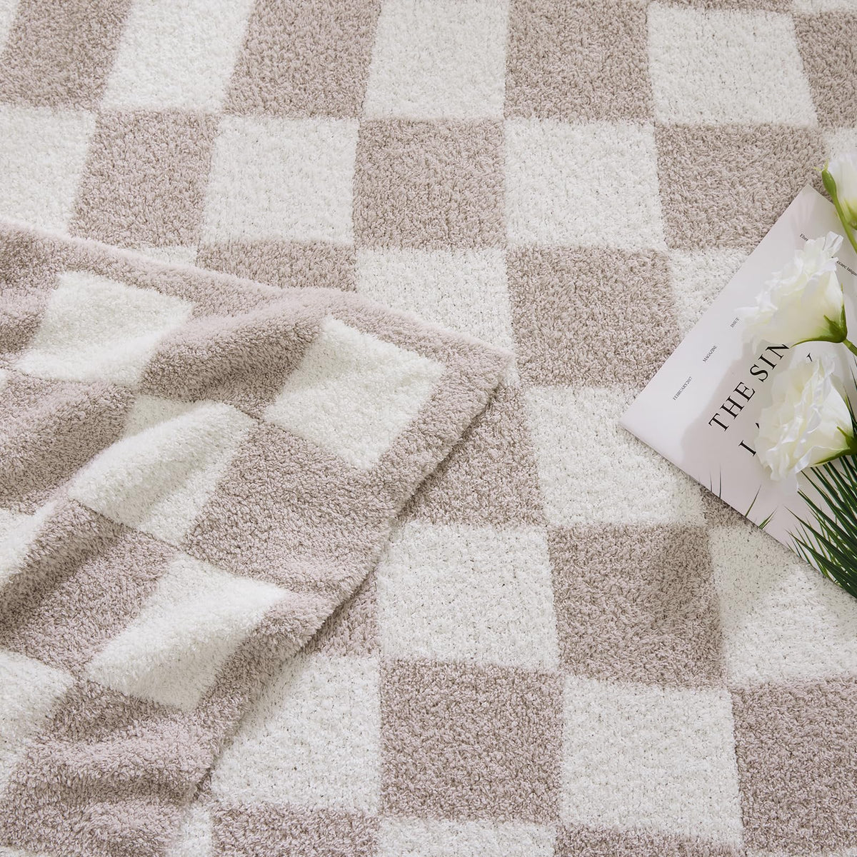 WRENSONGE blanket draped on a sofa enhances room decor with color and texture.
