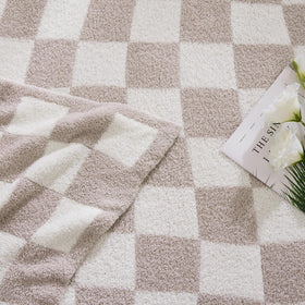 WRENSONGE blanket draped on a sofa enhances room decor with color and texture.
