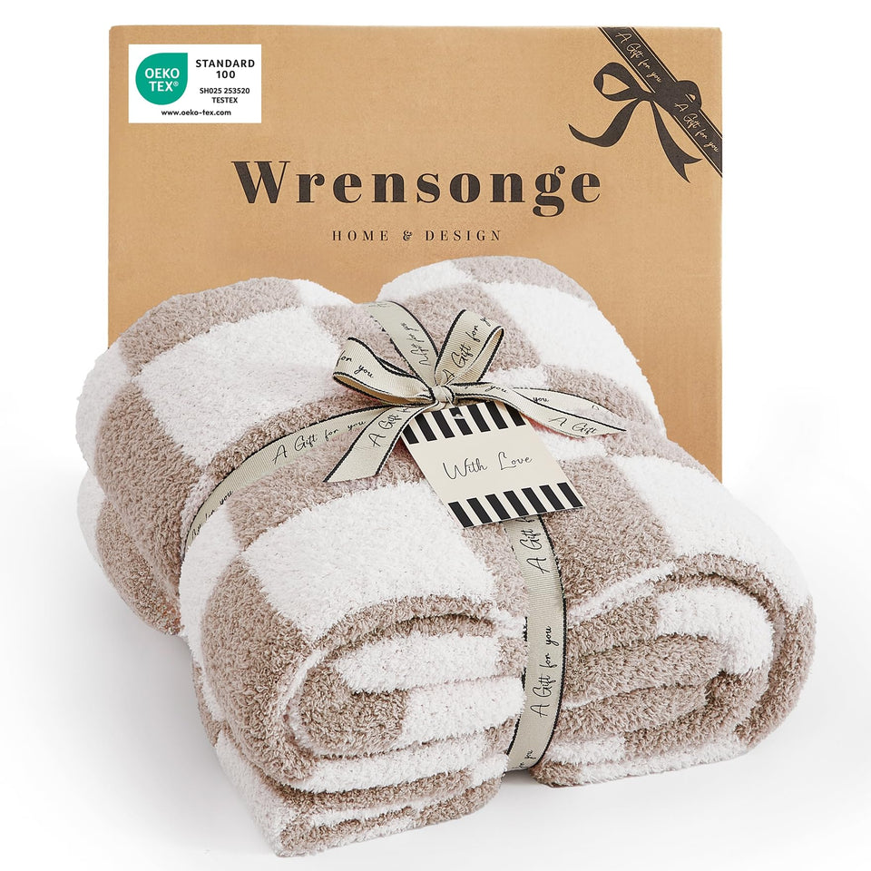 WRENSONGE checkered throw blanket in taupe adds warm texture to the couch.
