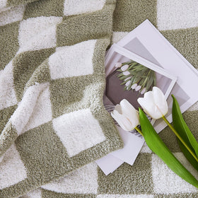 wrensonge checkered throw on bed for lounging and warmth