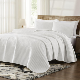 WRENSONGE king quilt on bed demonstrates versatile all-season use.