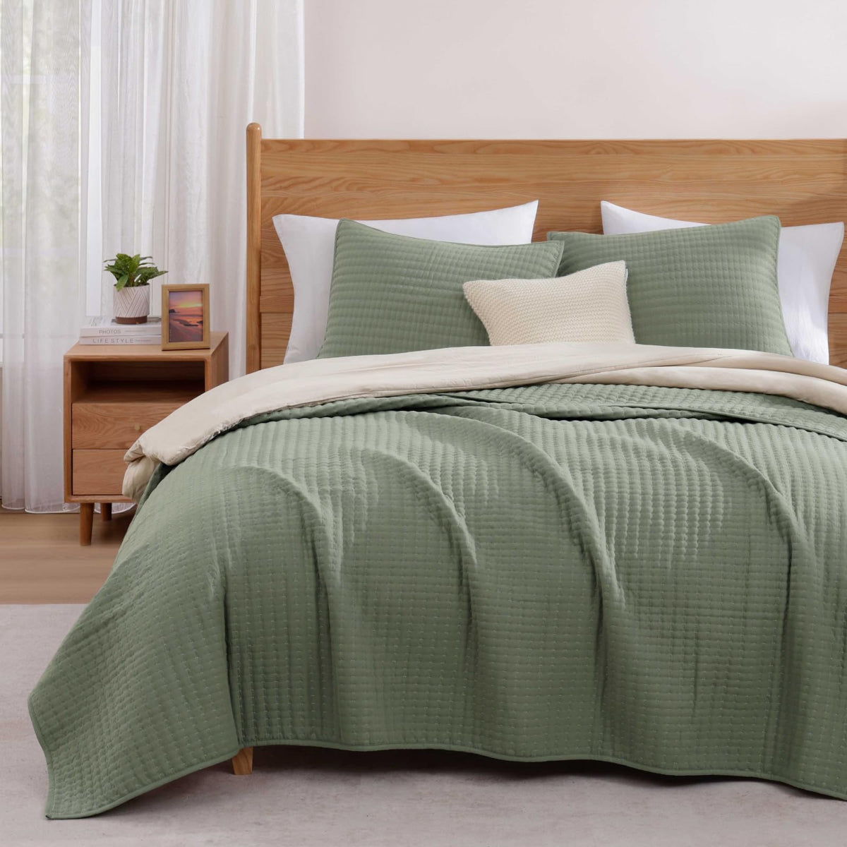 WRENSONGE King Size Quilt in sage green on bed offers lightweight all-season comfort.