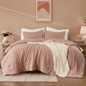 WRENSONGE queen comforter in dusty pink on bed offers lightweight all-season warmth