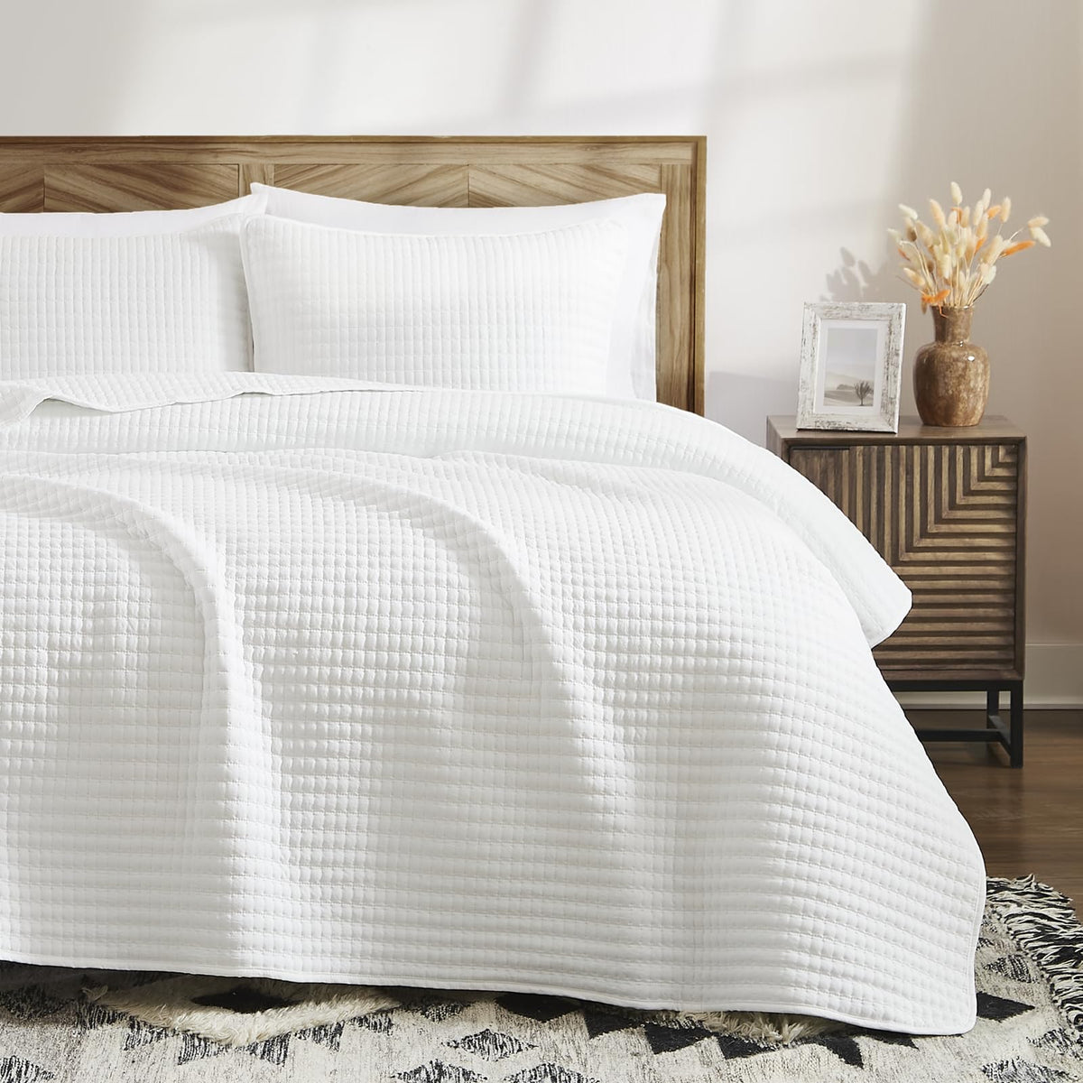 WRENSONGE quilt piping detail reinforces edge durability.