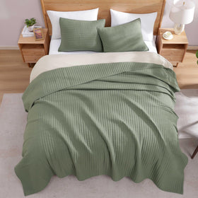 WRENSONGE quilt doubles as a sofa cover protecting furniture and color.