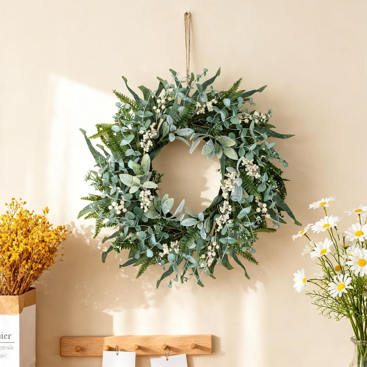 Layered greenery texture of the WSTPUPU wreath.