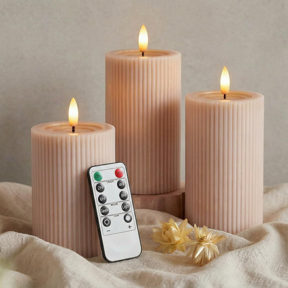 WYZworks fluted ribbed 4-inch pillar candle with warm blush beige glow.