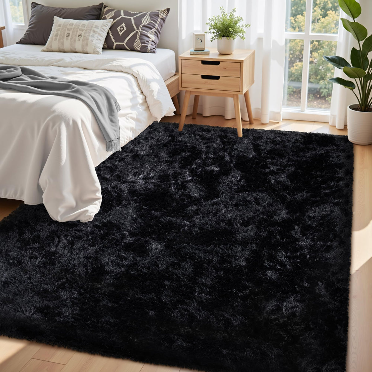 Xafir black fluffy rug with non-slip bottom keeps kids safe and play-ready.