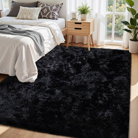 Xafir black fluffy rug with non-slip bottom keeps kids safe and play-ready.