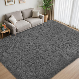 Xafir fluffy shag rug close-up showing plush texture on dark-grey surface.