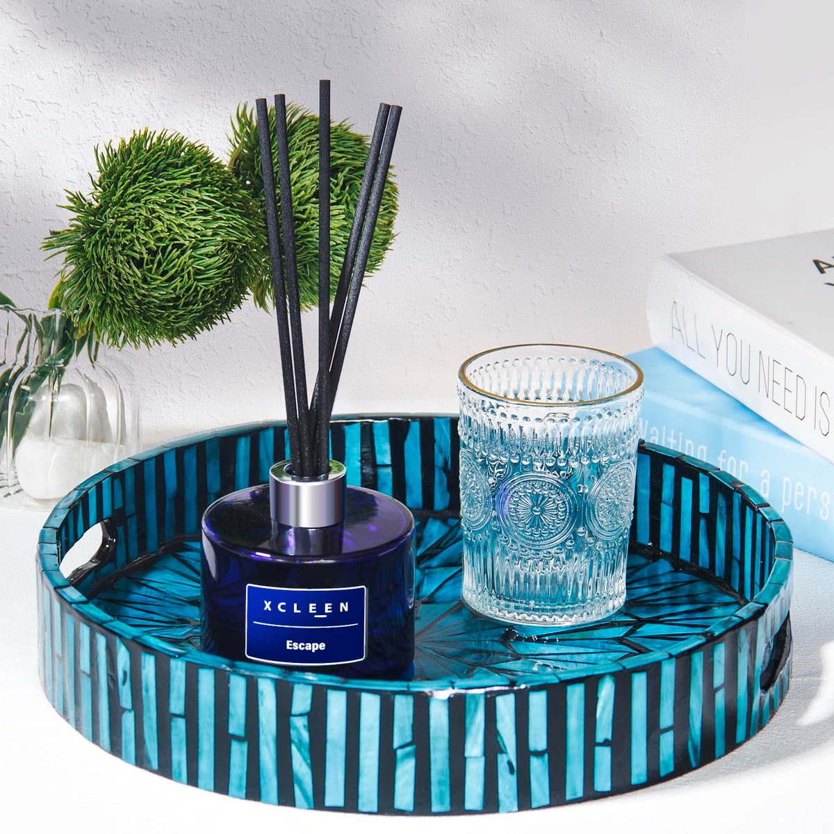 Xcleen dark blue bottle adds elegant accent to living room decor