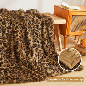 XeGe leopard blanket layered on bed for extra warmth