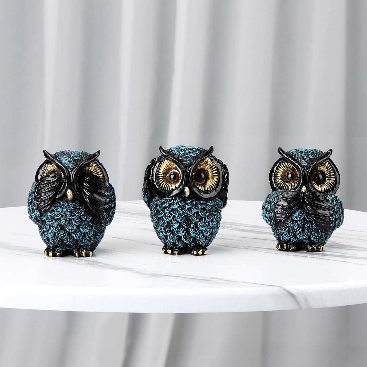 Xintim resin owl sculptures in blue, black, and gold for vibrant decor