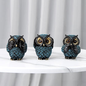 Xintim resin owl sculptures in blue, black, and gold for vibrant decor