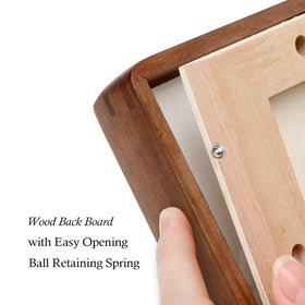 XKIILH edge-detail on the walnut frame emphasizes craftsmanship and rounded corners.