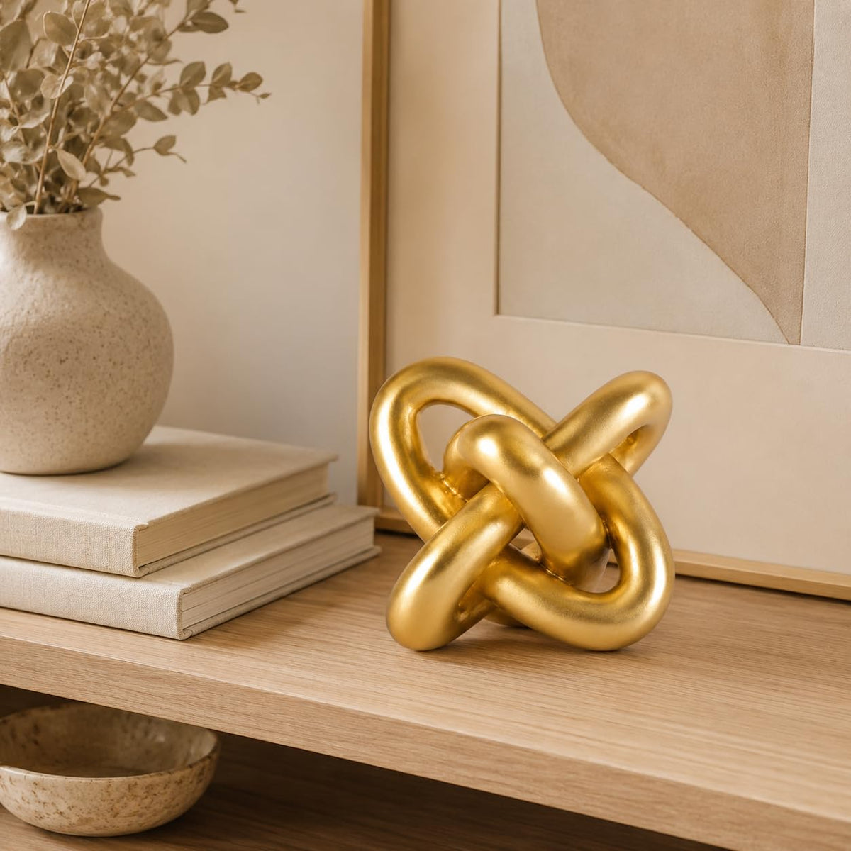 XMGZQ Gold Knot decor on a desk inspires a calm workspace.