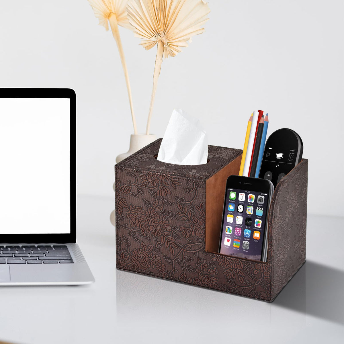 XNONE remote control holder integrated into tissue box for clutter-free surfaces.