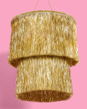 xo Fetti gold fringe detail on gold-tinsel chandelier