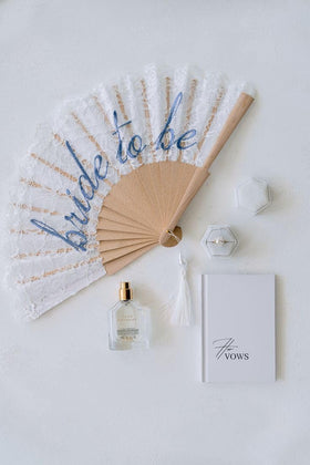 xo Fetti handheld fan complements bridesmaids with chic, practical style.