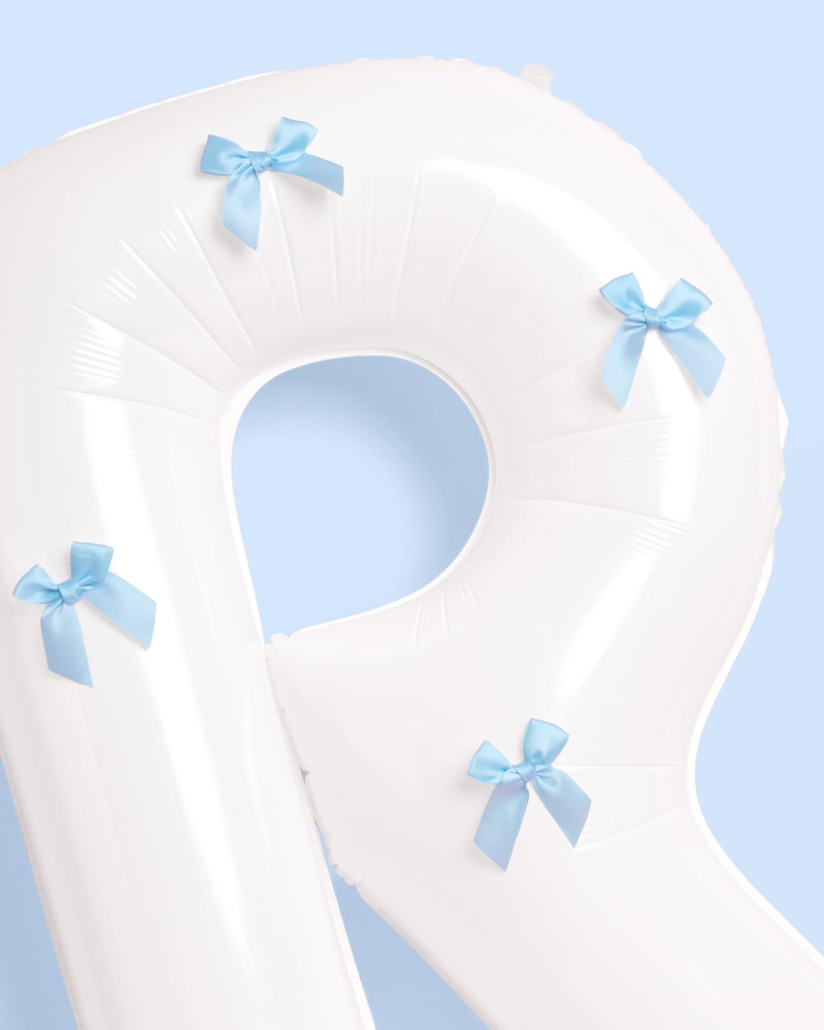xo Fetti helium-ready balloons float for dramatic moments
