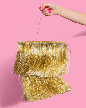 xo Fetti New Year backdrop with gold chandelier lighting