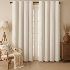 XOGUIBO boho blackout curtains with tassels add cozy texture and privacy.