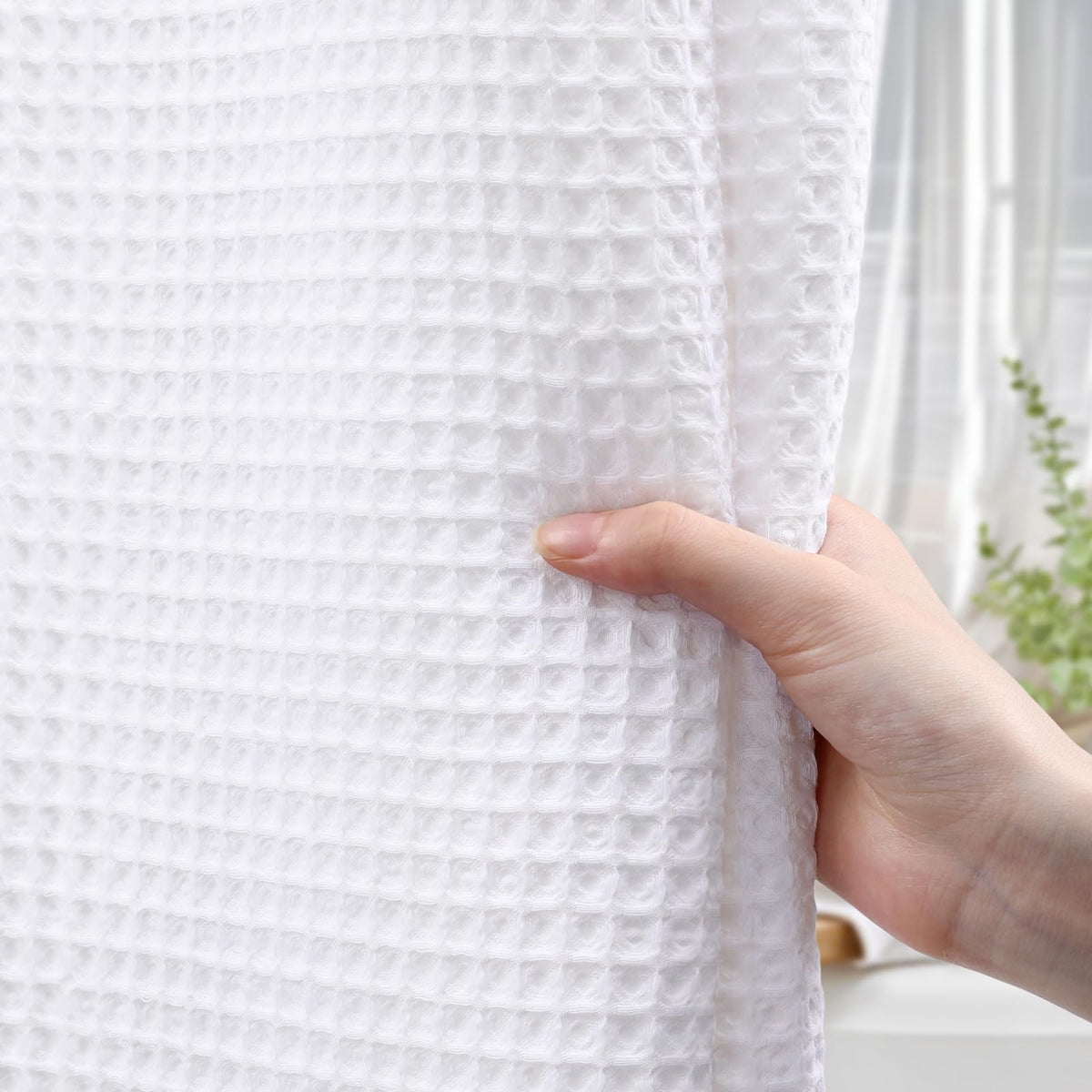 XOGUIBO heavyweight curtain stays in place for privacy during showers.